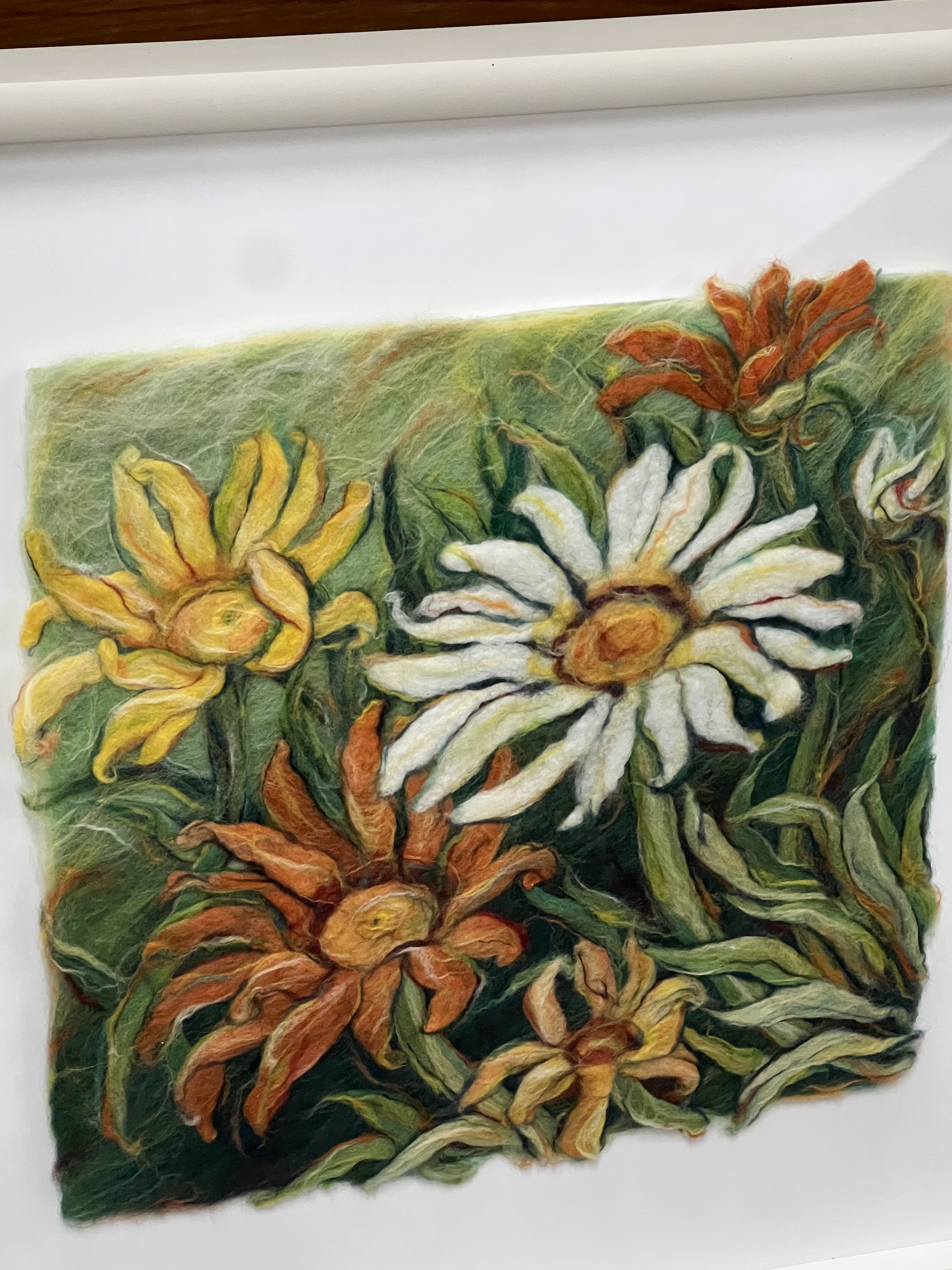 A framed velvet panel fragment and a framed floral woolwork panel, larger 38 x 59cm